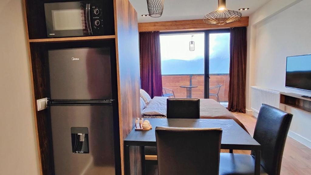 TV a/nebo společenská místnost v ubytování New Gudauri Twins 354 Mountain view