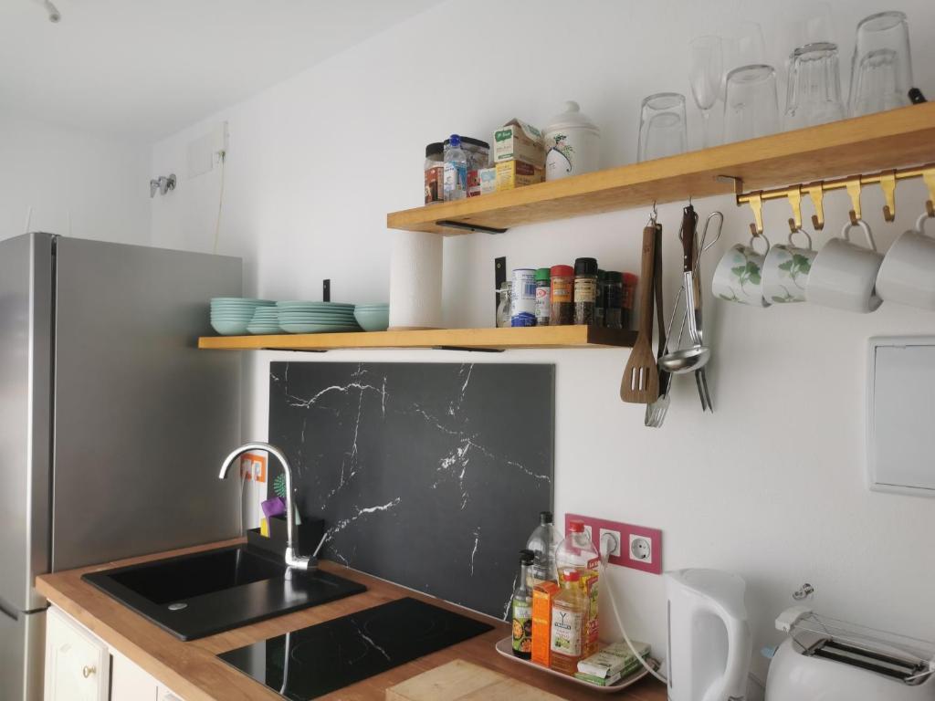 a kitchen with a sink and a counter top at ABA DALÍ in Conil de la Frontera