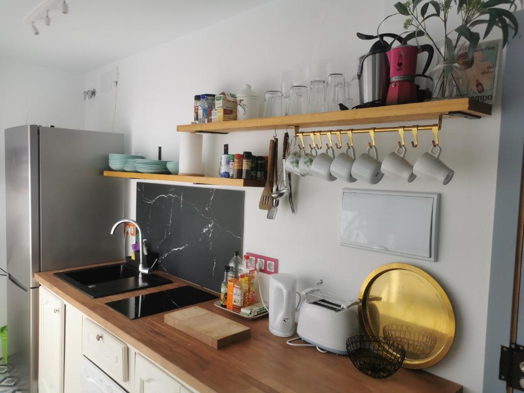 a kitchen with a sink and a counter top at ABA DALÍ in Conil de la Frontera