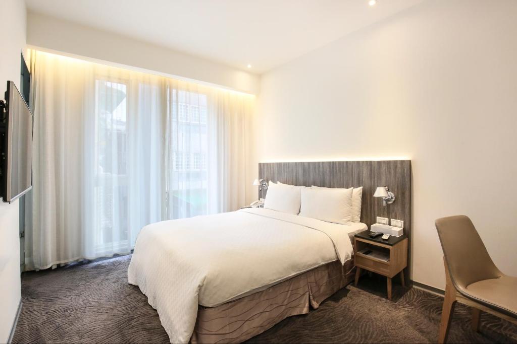 Postel nebo postele na pokoji v ubytování Dandy Hotel - Tianjin Branch