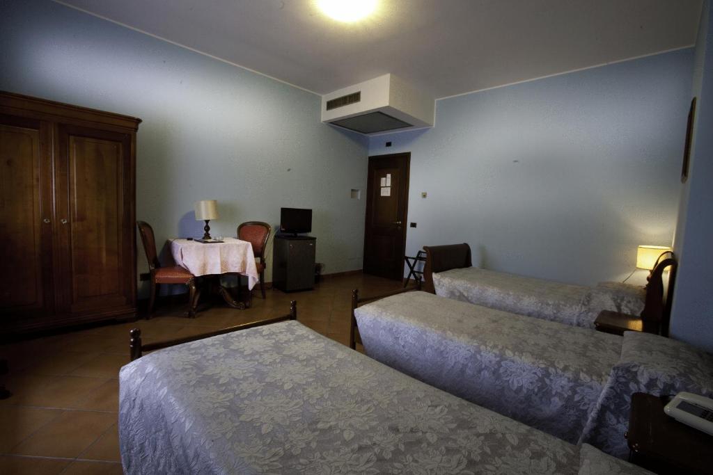 Postel nebo postele na pokoji v ubytování Hotel Nastro Azzurro