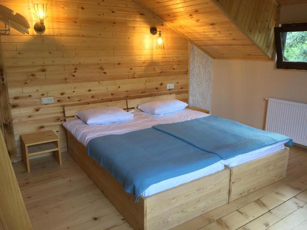 Postel nebo postele na pokoji v ubytování Ioska's House