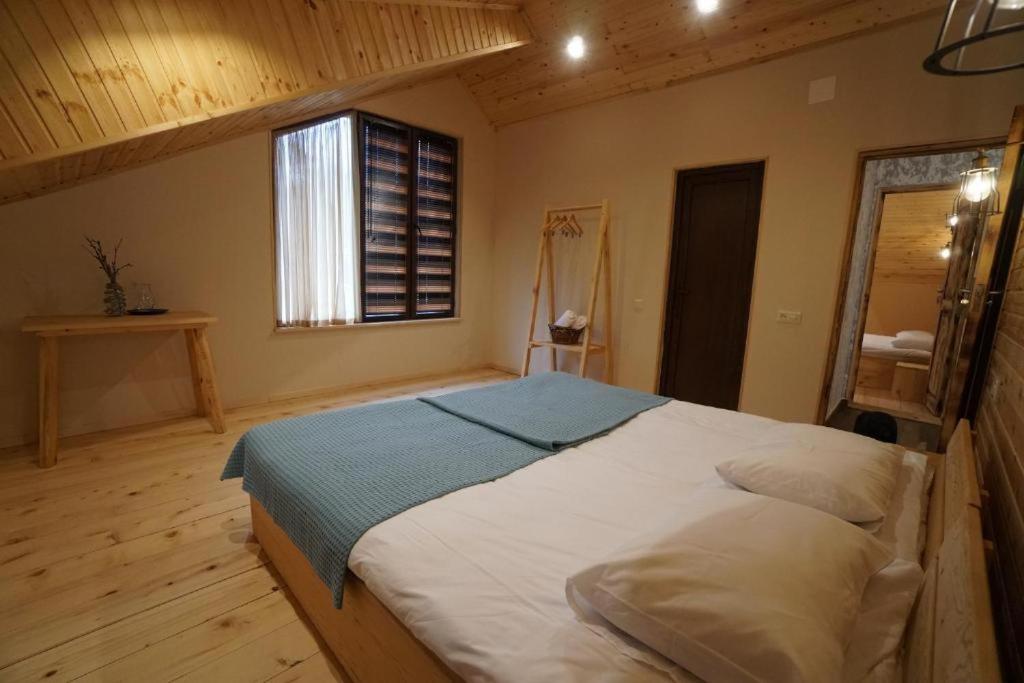 Postel nebo postele na pokoji v ubytování Ioska's House
