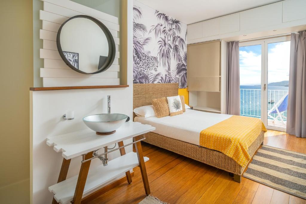Кровать или кровати в номере Hotel Kalura