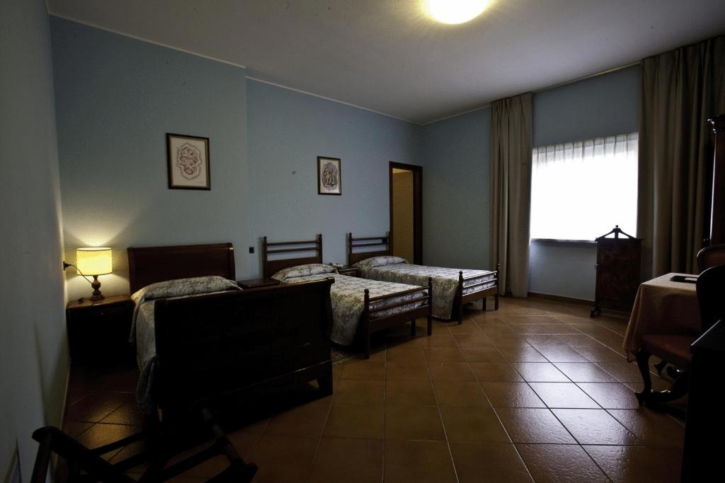 Postel nebo postele na pokoji v ubytování Hotel Nastro Azzurro