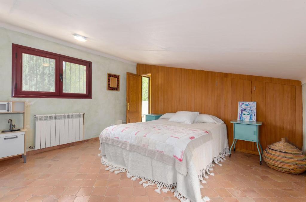 Postel nebo postele na pokoji v ubytování YourHouse Sa Cova