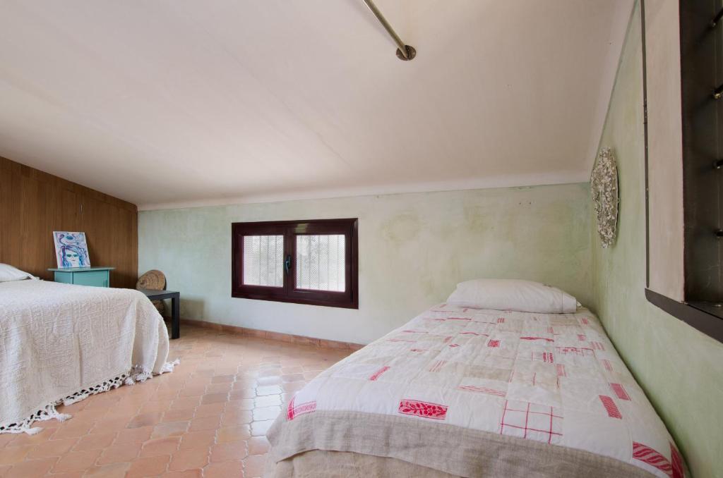 Postel nebo postele na pokoji v ubytování YourHouse Sa Cova