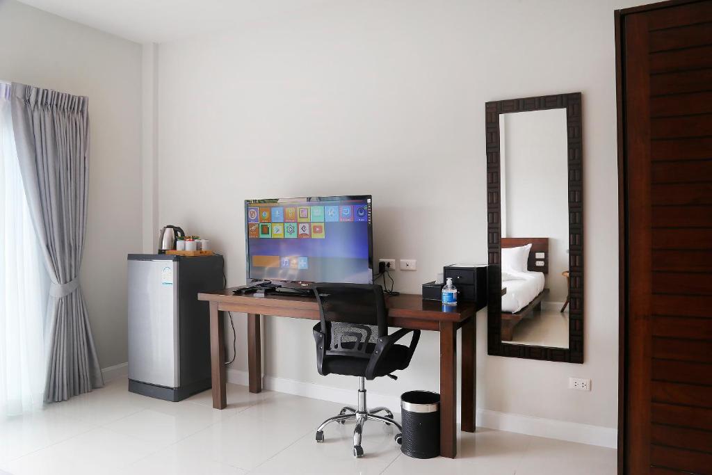 TV a/nebo společenská místnost v ubytování The Langstan Suites