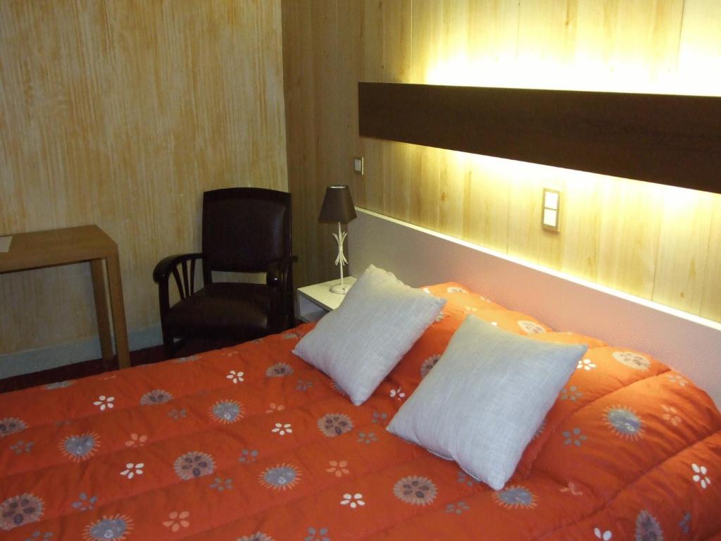 Voodi või voodid majutusasutuse Hôtel du Val d'Aure toas