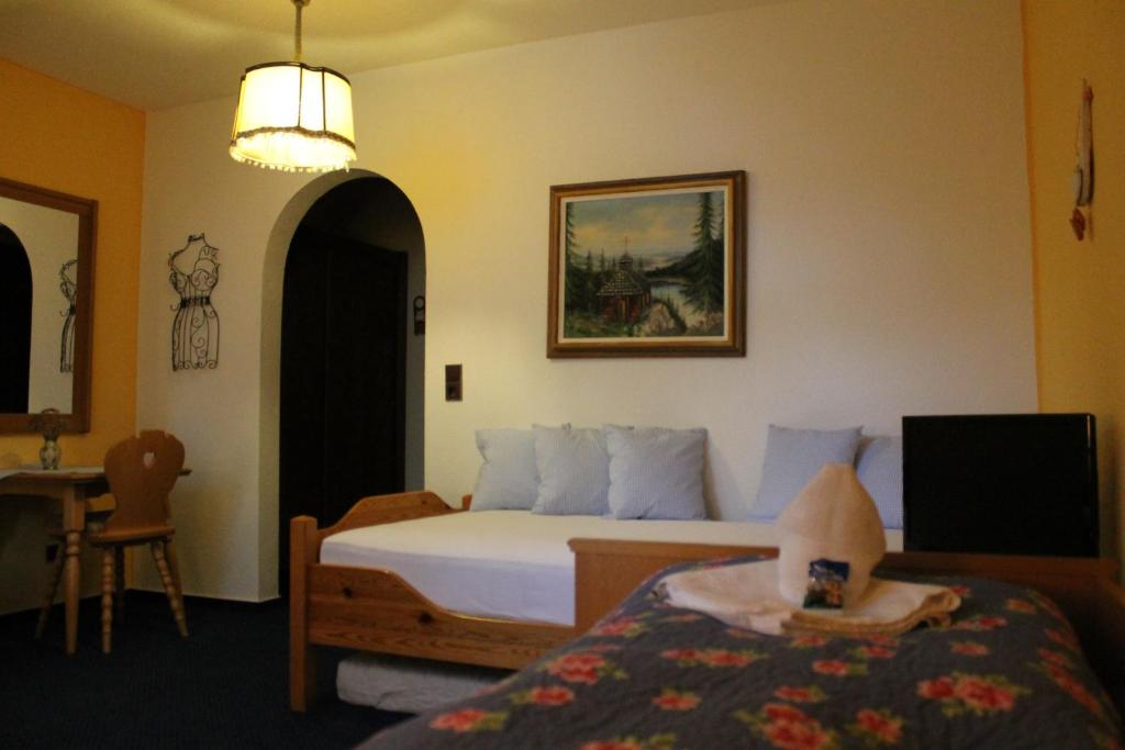 Postel nebo postele na pokoji v ubytování Hotel Schäfflerhof