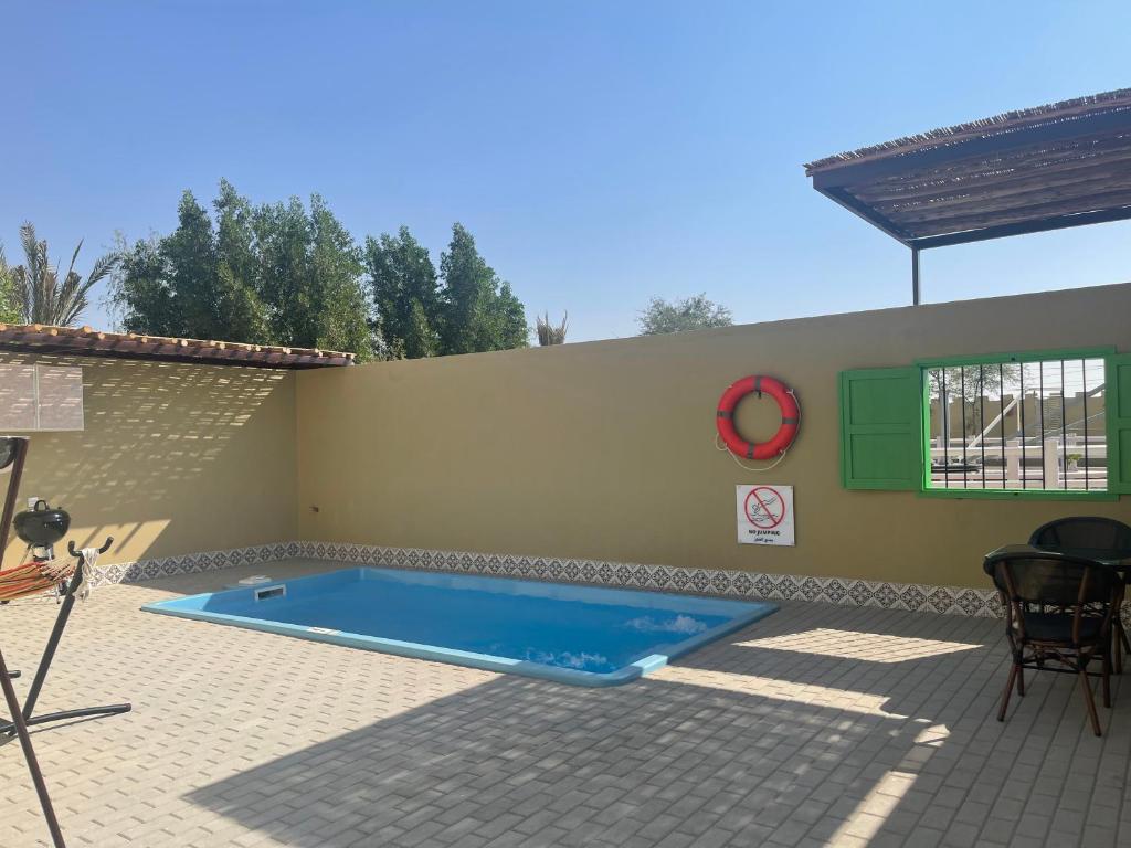 Bazén v ubytování Al Bait resort with private swimming pools -HRS stables nebo v jeho okolí
