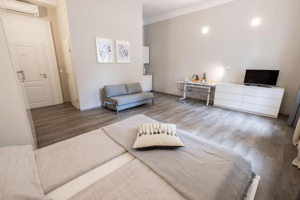 TV a/nebo společenská místnost v ubytování 4flats
