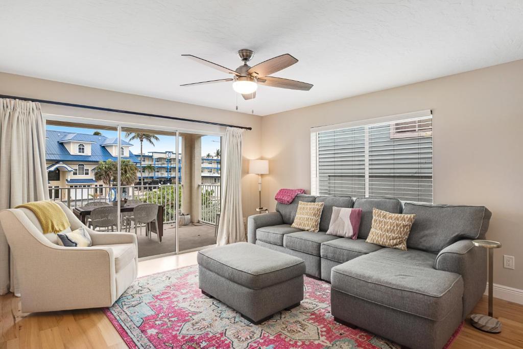 a living room with a couch and a chair at The Salty Seahorse in Key Colony Beach