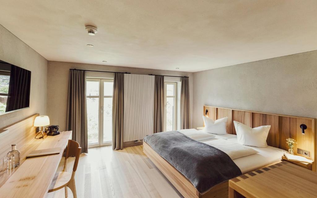 Postel nebo postele na pokoji v ubytování Hotel Gasthof Adler
