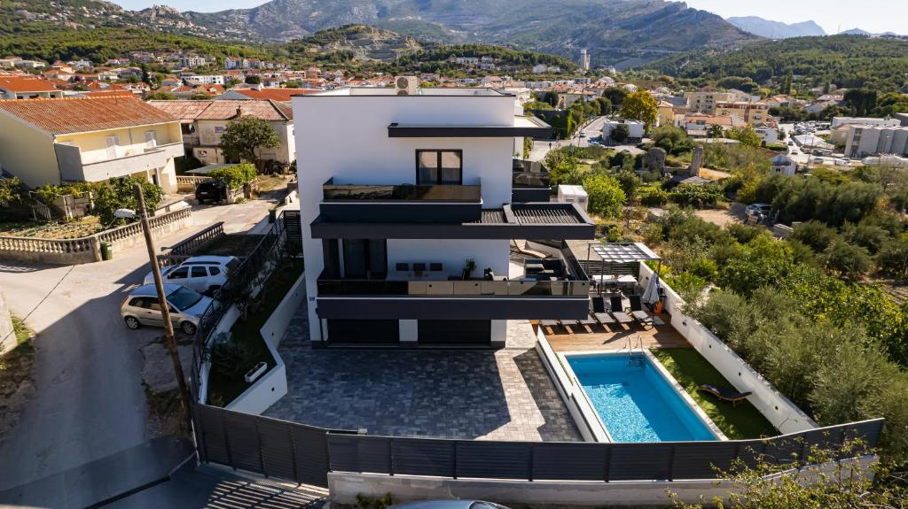 an aerial view of a house with a swimming pool at Villa Porta Salonae in Solin