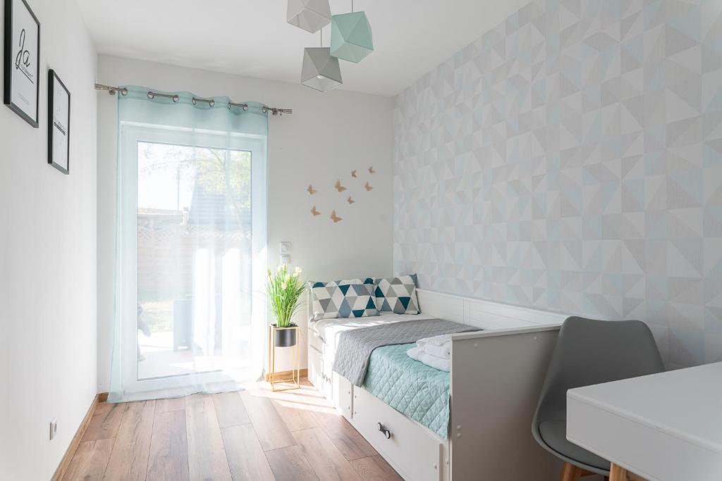 Posteľ alebo postele v izbe v ubytovaní Apartamenty Pod Cisem Lux