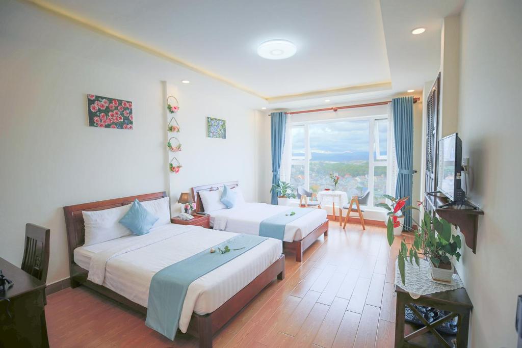 Giường trong phòng chung tại Rose Valley Hotel Da Lat Vietnam