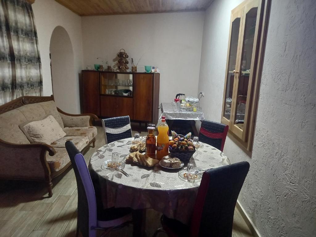 a table with food on it in a living room at Spardishi tower in Mestia