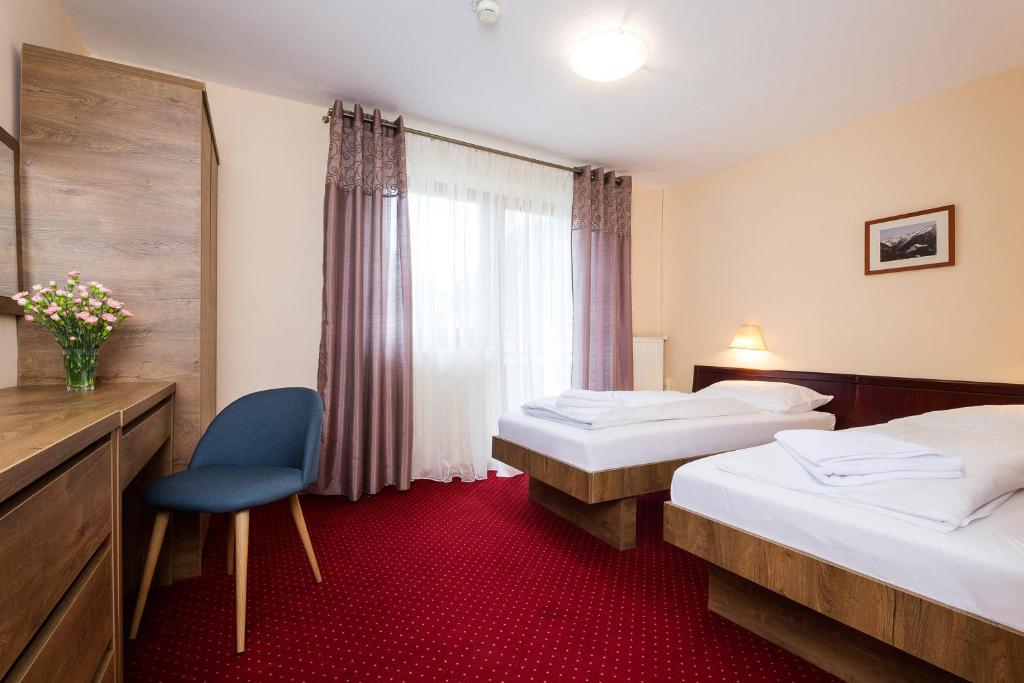 Postel nebo postele na pokoji v ubytování Hotel Post Fusch