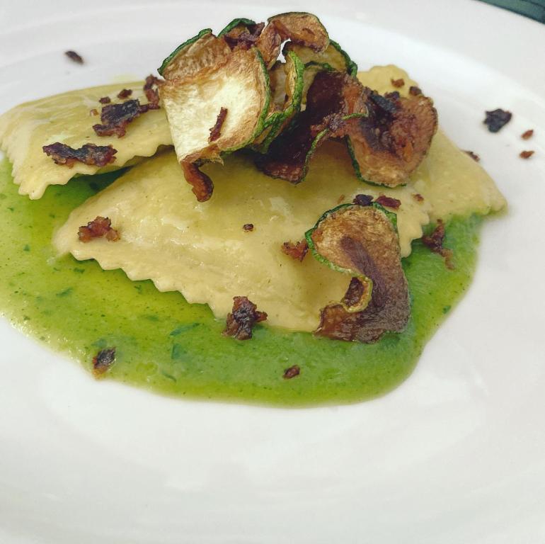 a piece of food on a white plate at Masseria Valente in Ostuni
