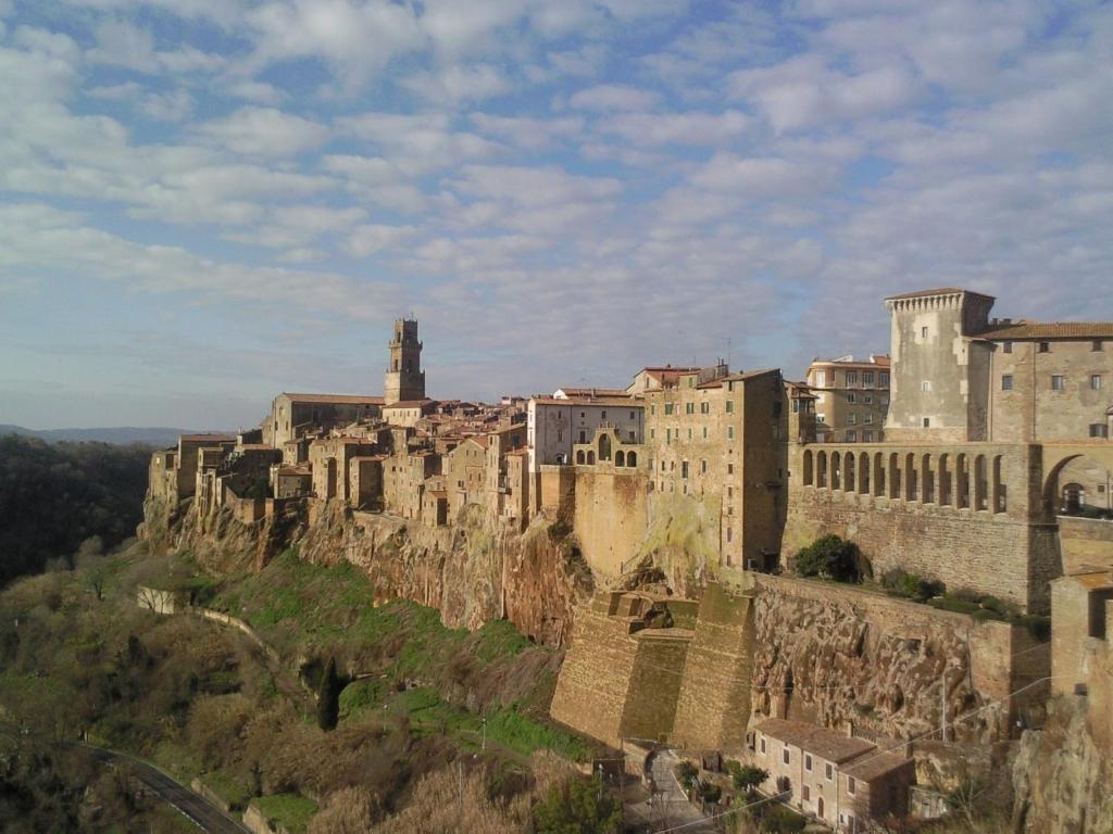 an old castle on top of a mountain at Appartamenti a Pitigliano in Pitigliano