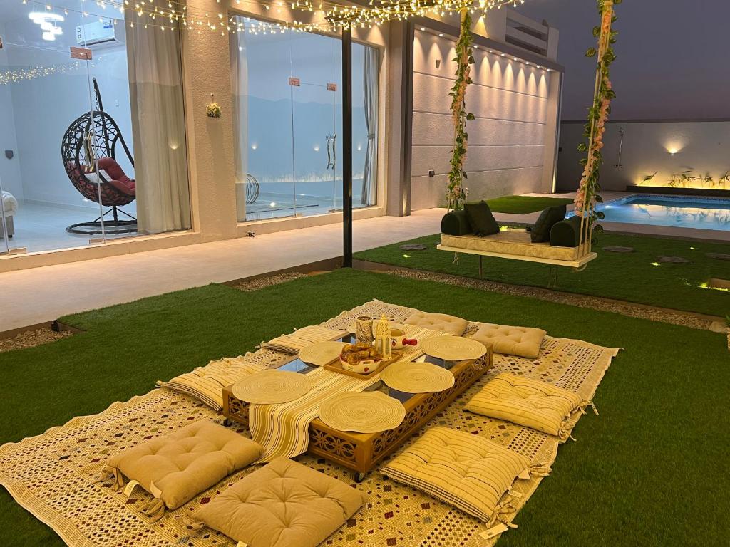 a table in a living room with a table sidx sidx sidx at alsaif camp in Bidiyah