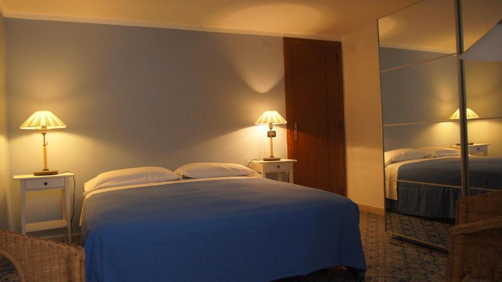 Postel nebo postele na pokoji v ubytování B&B Sciabakè