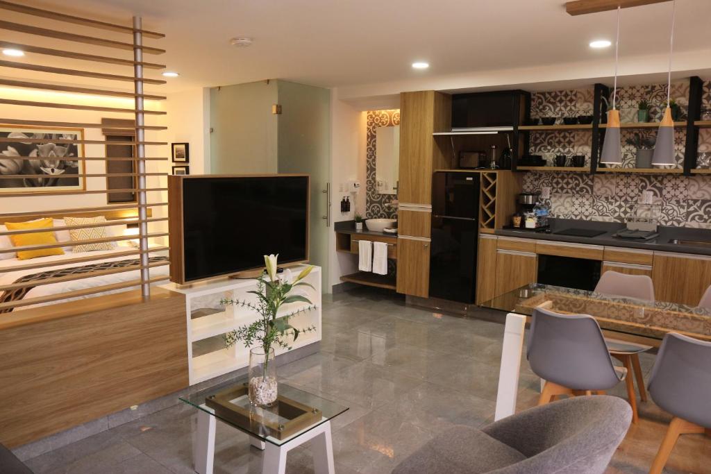 TV a/nebo společenská místnost v ubytování The Lu'um House