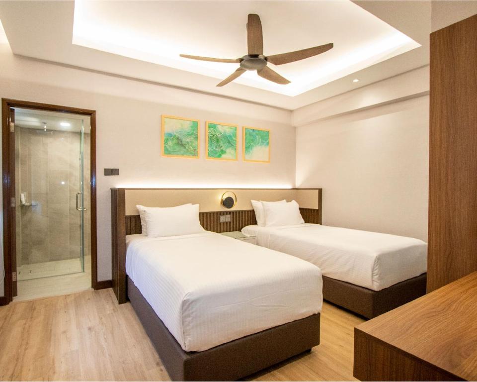 Letto o letti in una camera di Villea Port Dickson