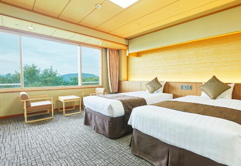 Postel nebo postele na pokoji v ubytování KAMENOI HOTEL Fukui