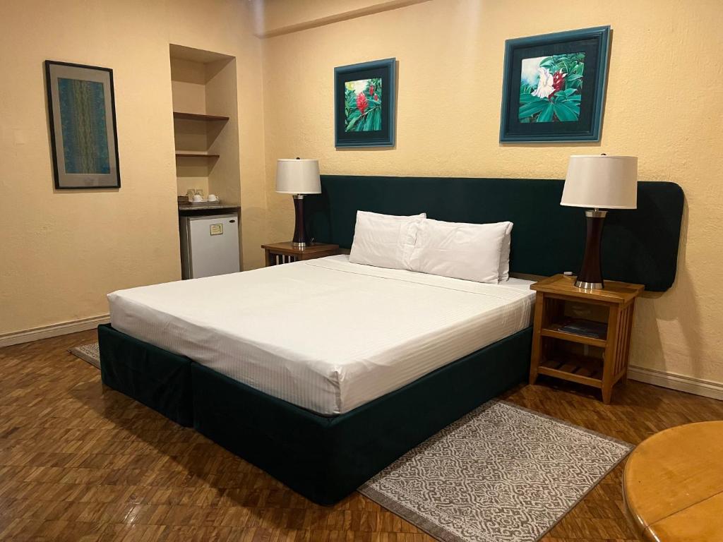 Postel nebo postele na pokoji v ubytování Coco Grande Hotel