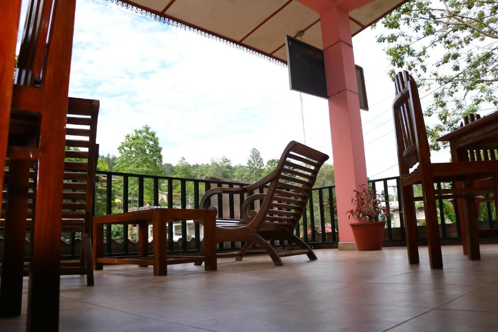 two chairs and a table on a porch at Little Heaven in Ella