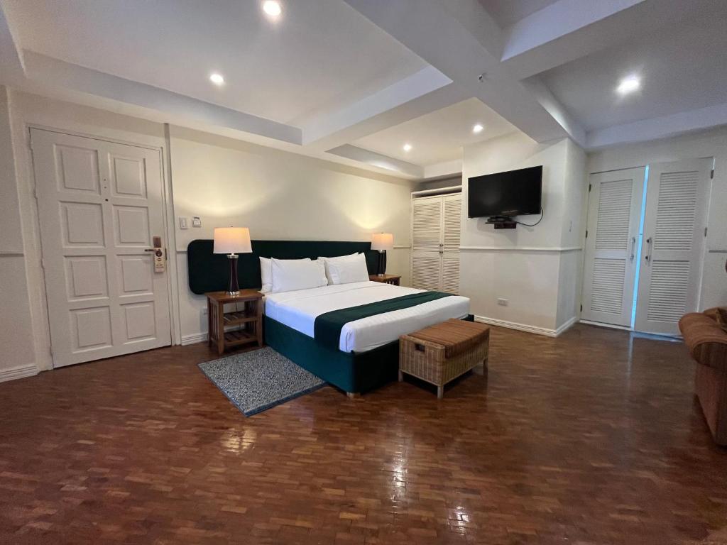 Postel nebo postele na pokoji v ubytování Coco Grande Hotel
