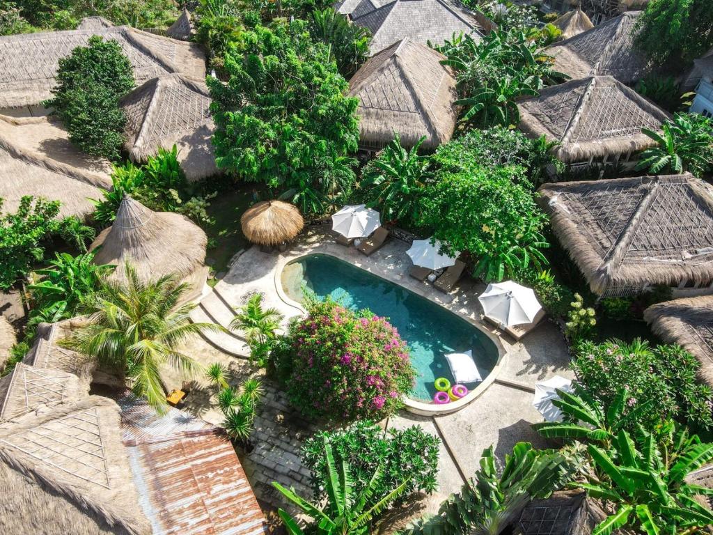 an aerial view of a resort with a swimming pool at Le Yanandra Bali Resort in Jimbaran