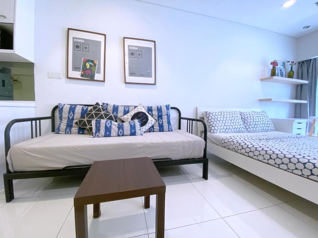 Postel nebo postele na pokoji v ubytování Mercu Summer Suites Bernice KLCC