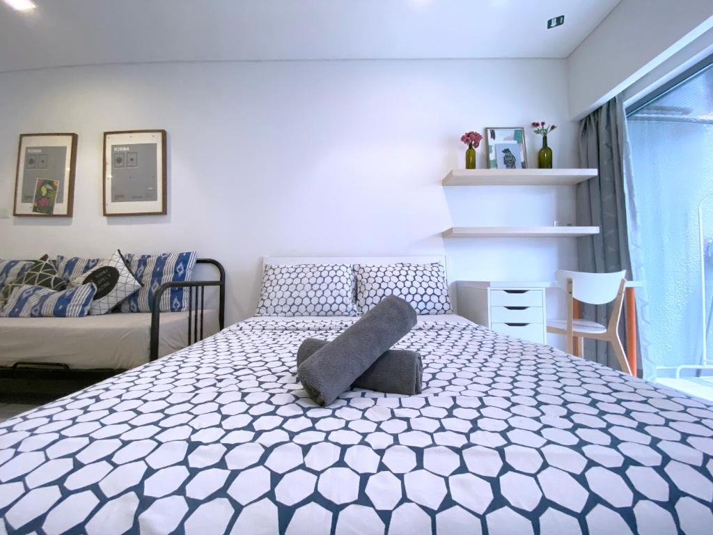 Postel nebo postele na pokoji v ubytování Mercu Summer Suites Bernice KLCC