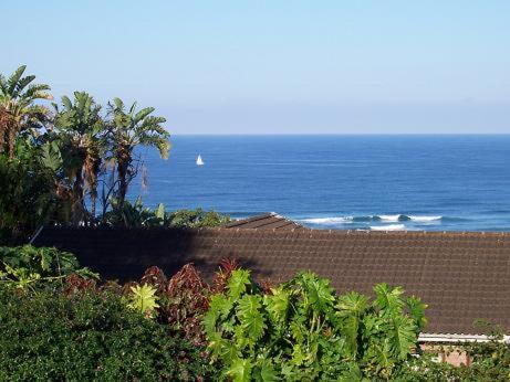 a view of the ocean with a boat in the water at Birdcage B&B in Amanzimtoti