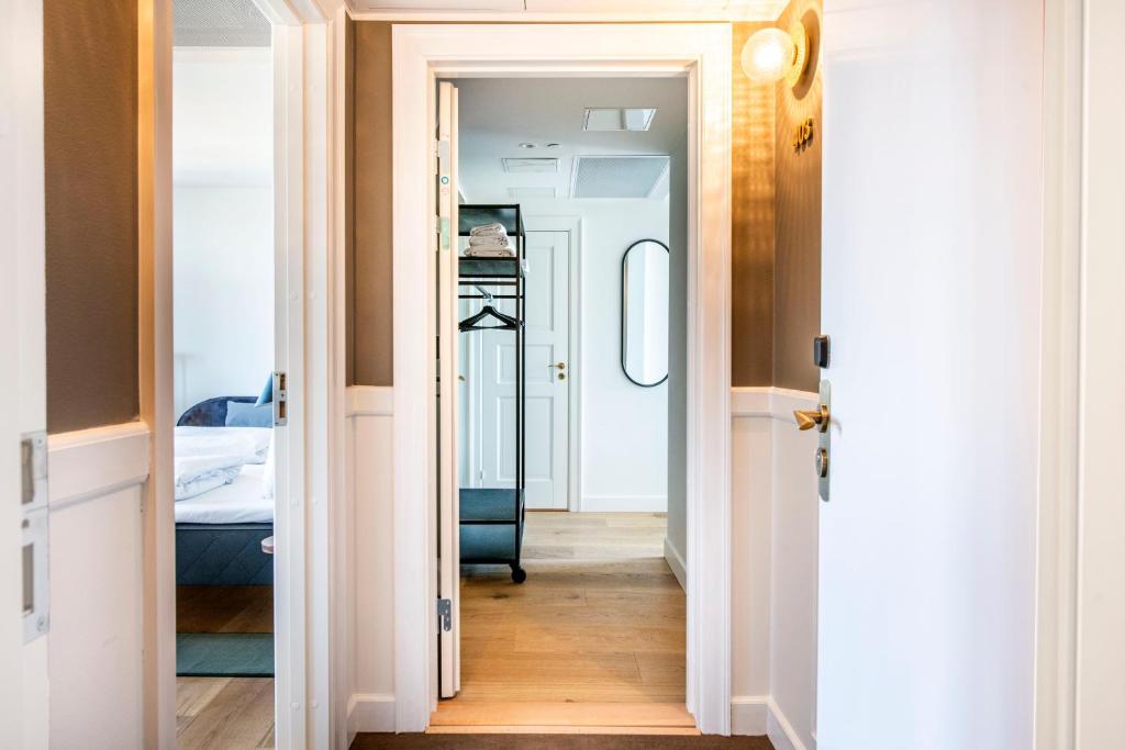 Postel nebo postele na pokoji v ubytování Hotel Sct. Thomas