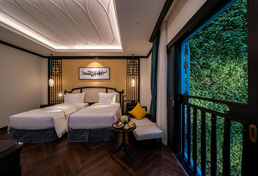 Giường trong phòng chung tại Potique Hotel
