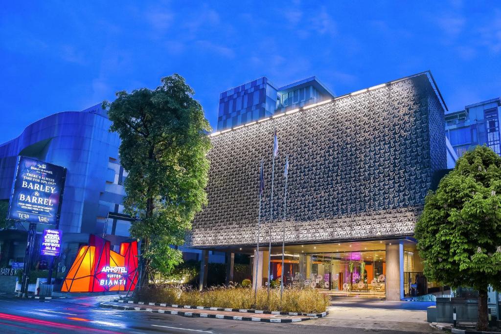 a building with a sign on the side of it at ARTOTEL Suites Bianti Yogyakarta, CHSE Certified in Yogyakarta