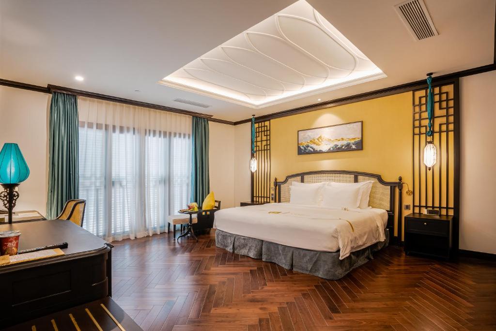 Giường trong phòng chung tại Potique Hotel