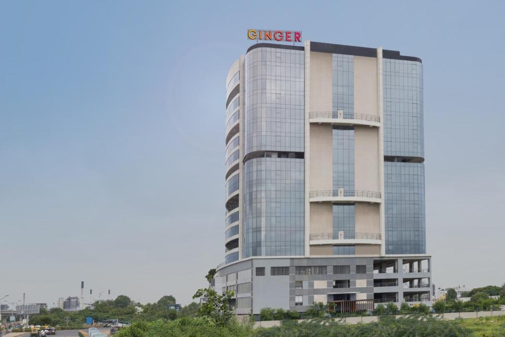 a building with a giger sign on top of it at Ginger Ahmedabad RTO Circle in Ahmedabad