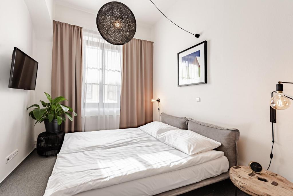 Ένα ή περισσότερα κρεβάτια σε δωμάτιο στο Hotel Pivoňka