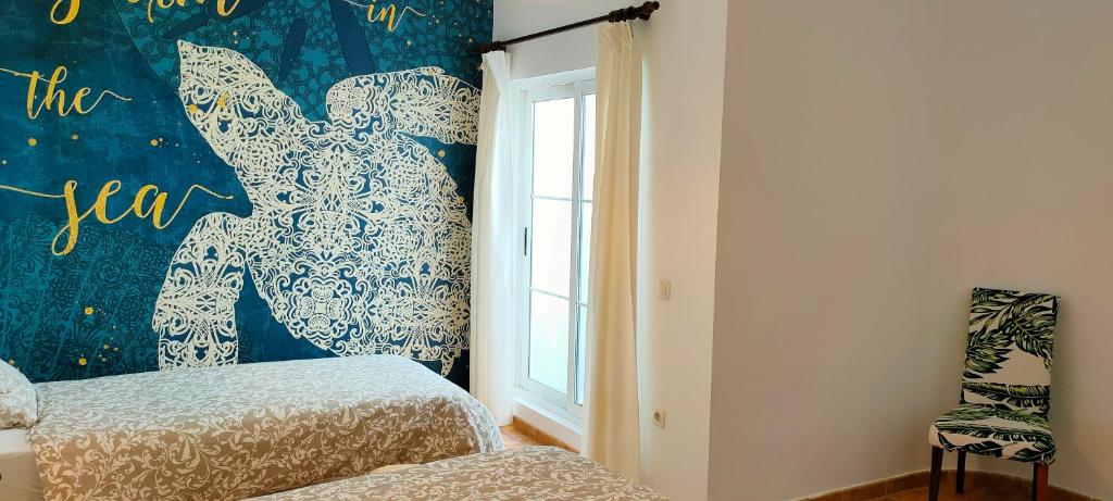 A bed or beds in a room at Villa Fedelian 2 Playa Blanca