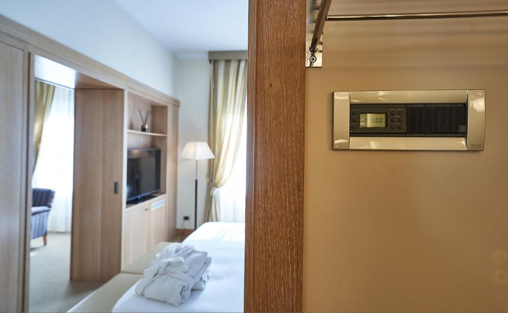Postel nebo postele na pokoji v ubytování Hotel Astoria