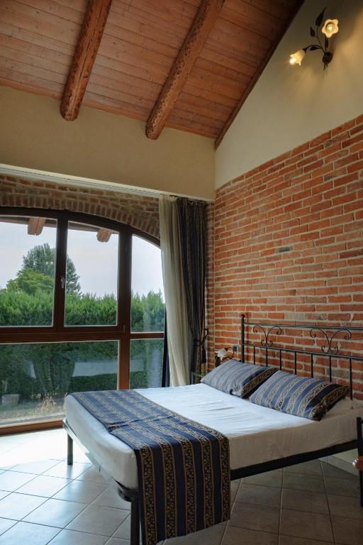 Postel nebo postele na pokoji v ubytování Hotel Le Botti