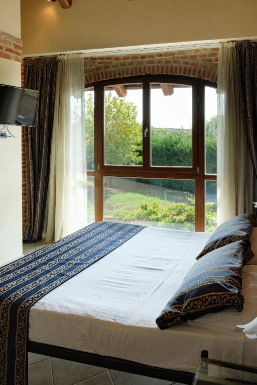 Postel nebo postele na pokoji v ubytování Hotel Le Botti