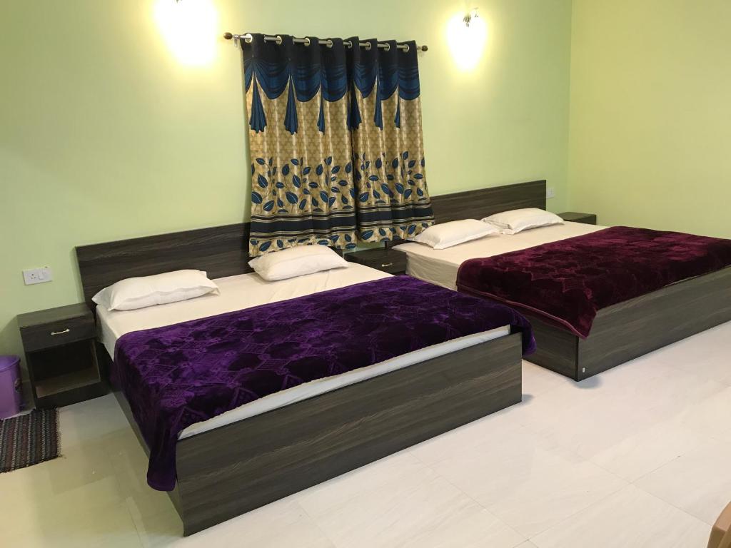 Postel nebo postele na pokoji v ubytování HAPPYSTAY rooms and cottages