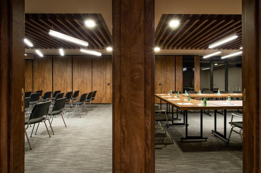 a conference room with a long table and chairs at Amsterdam Hotel in Belgrade