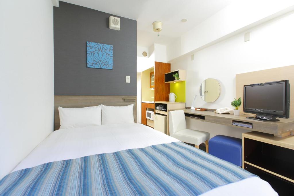 En eller flere senger på et rom på HOTEL MYSTAYS Ueno Inaricho